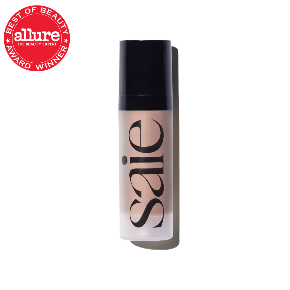 Beige liquid foundation bottle with black cap and Satic branding, Allure award badge visible