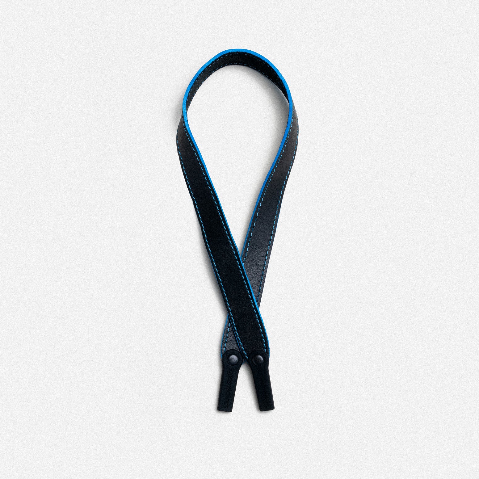 Black leather neck strap with blue trim and snap fasteners