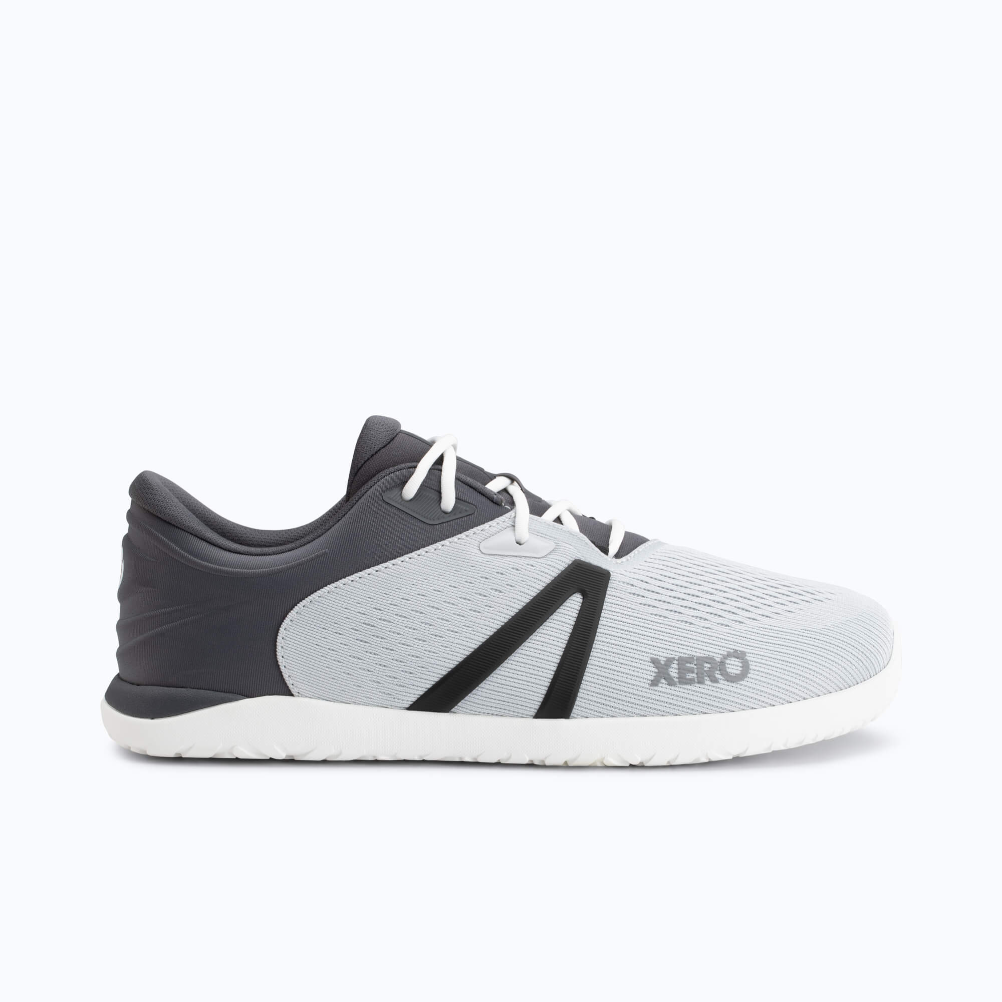 Light gray and dark gray running shoe with white laces and white sole, shown from the side