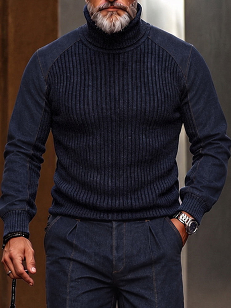 Man wearing navy ribbed turtleneck and matching pleated navy pants with a watch