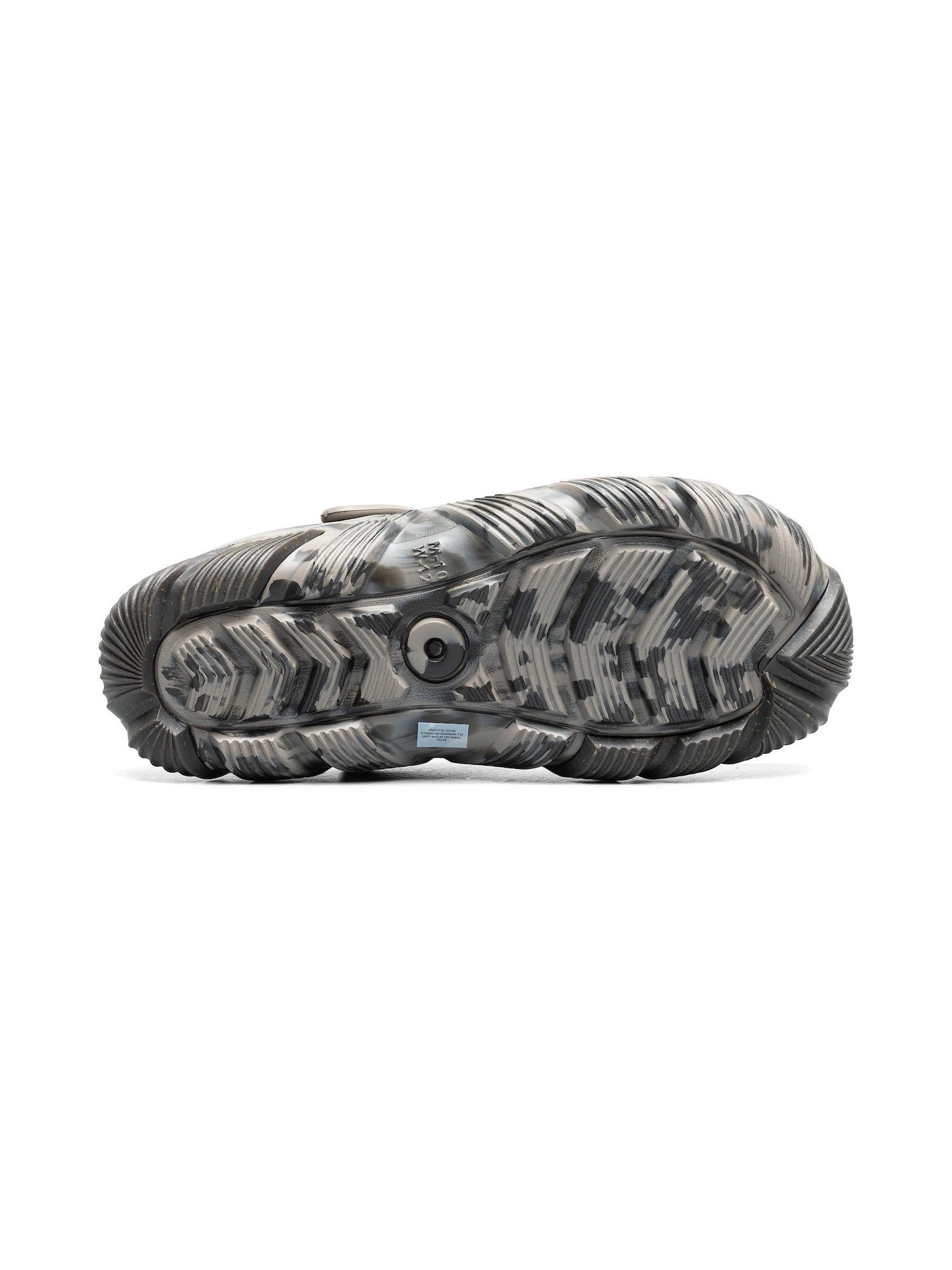 Bottom view of sole showing distinctive tread pattern with grooved texture across white and gray surface