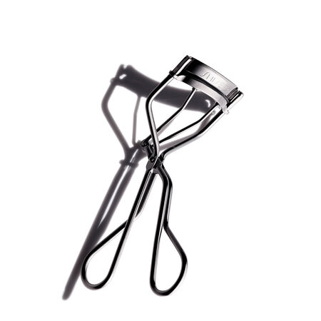 Black eyelash curler with metal clamp and handle