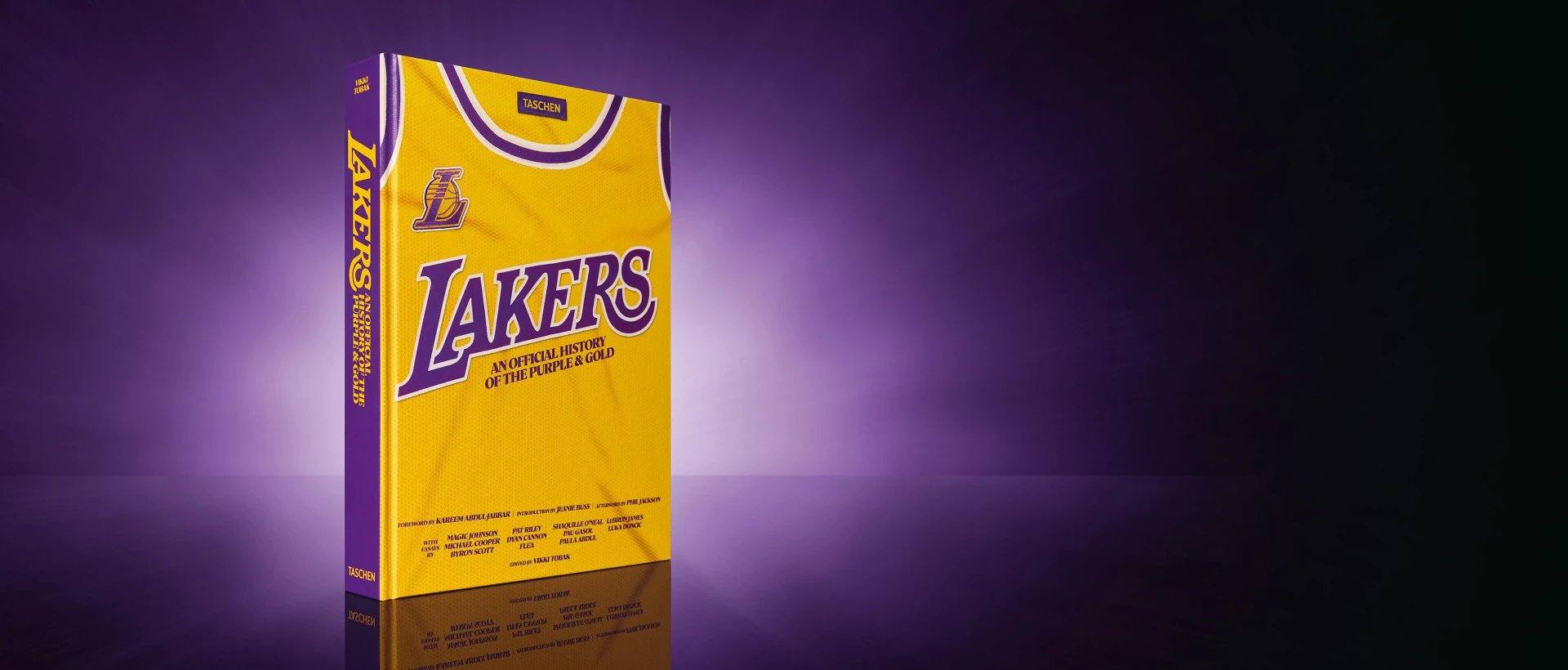 Yellow and purple Los Angeles Lakers team jersey-styled book cover titled 'An Official History of the Purple & Gold' by TASCHEN