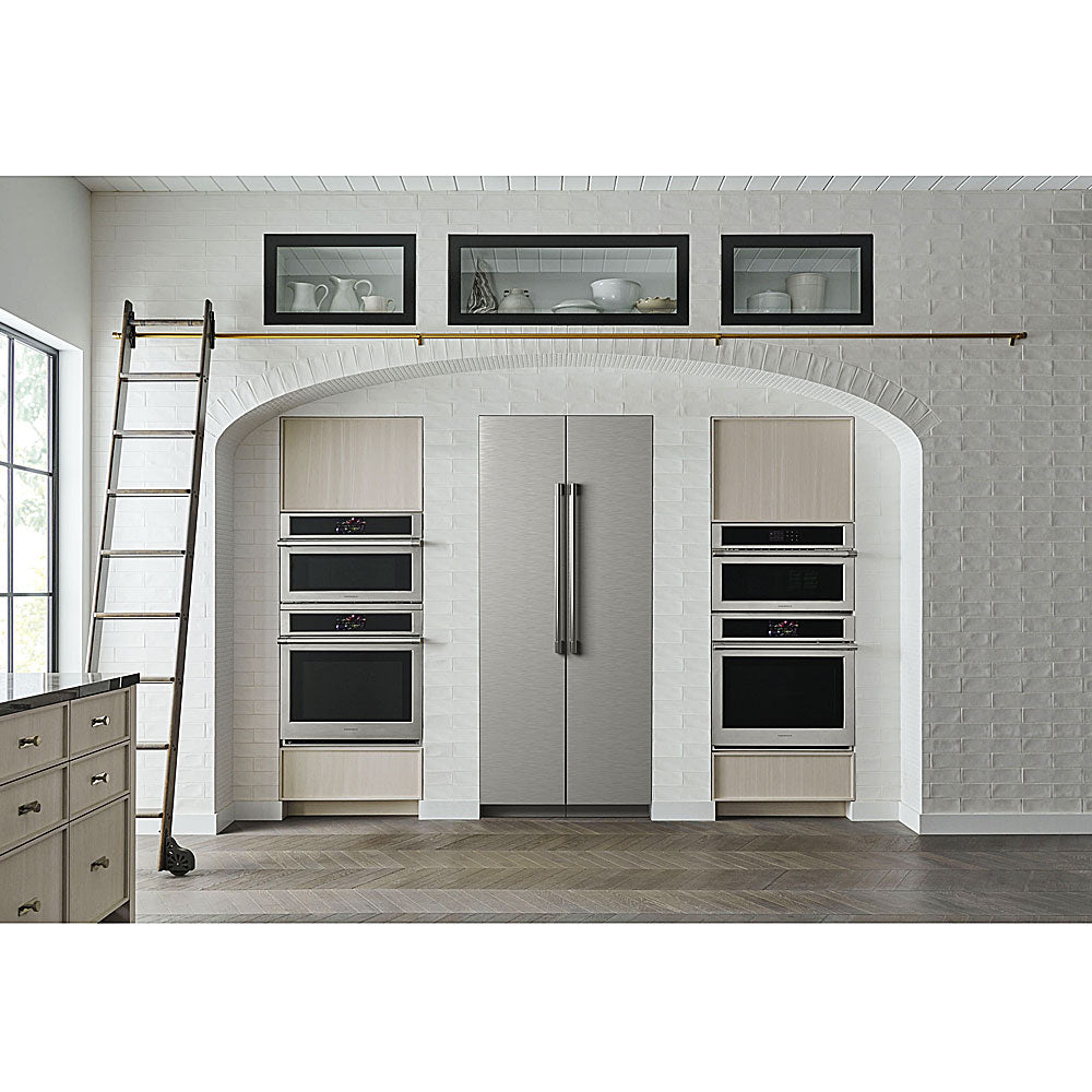 Modern kitchen with stainless steel refrigerator and wall-mounted double wall ovens