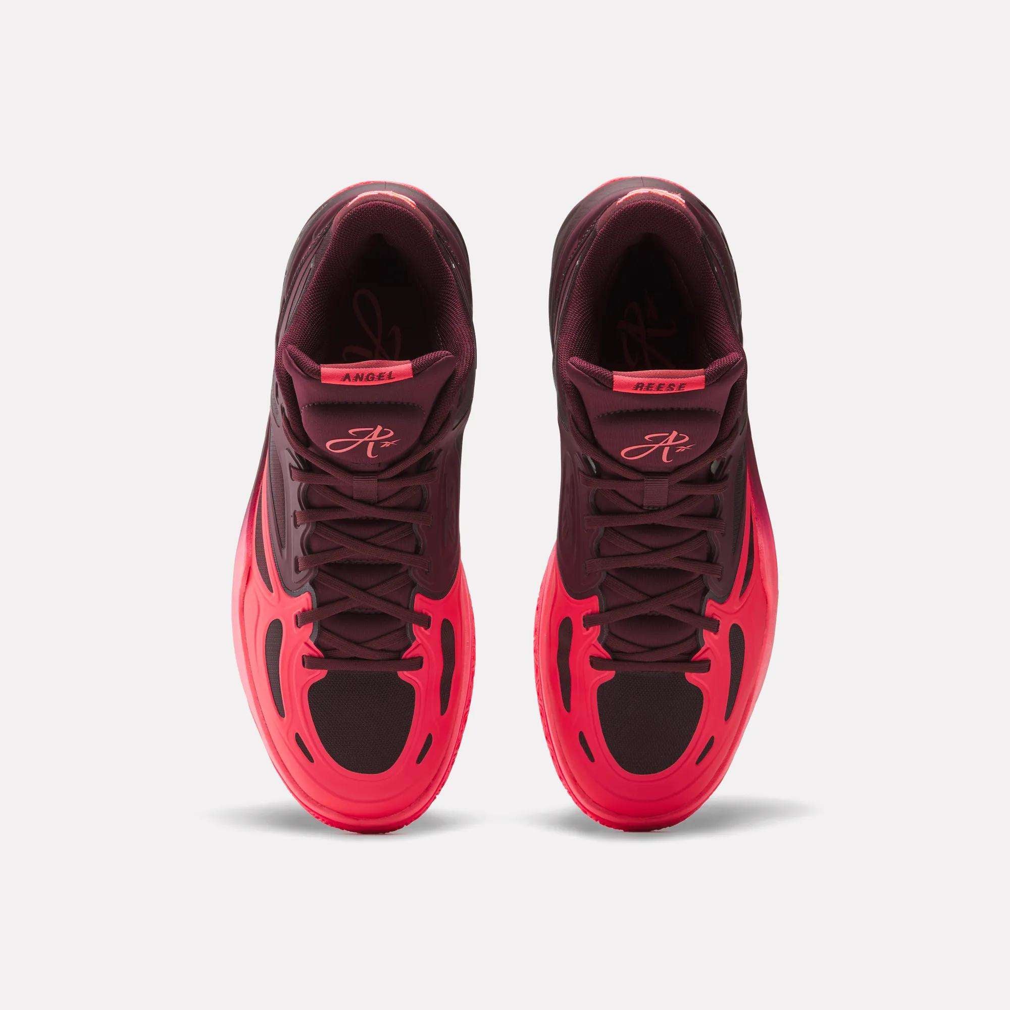 Pair of burgundy and neon pink high-top sneakers shown from above