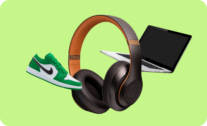 Headphones with orange accents surrounded by green sneaker, laptop, and tablet on lime green background