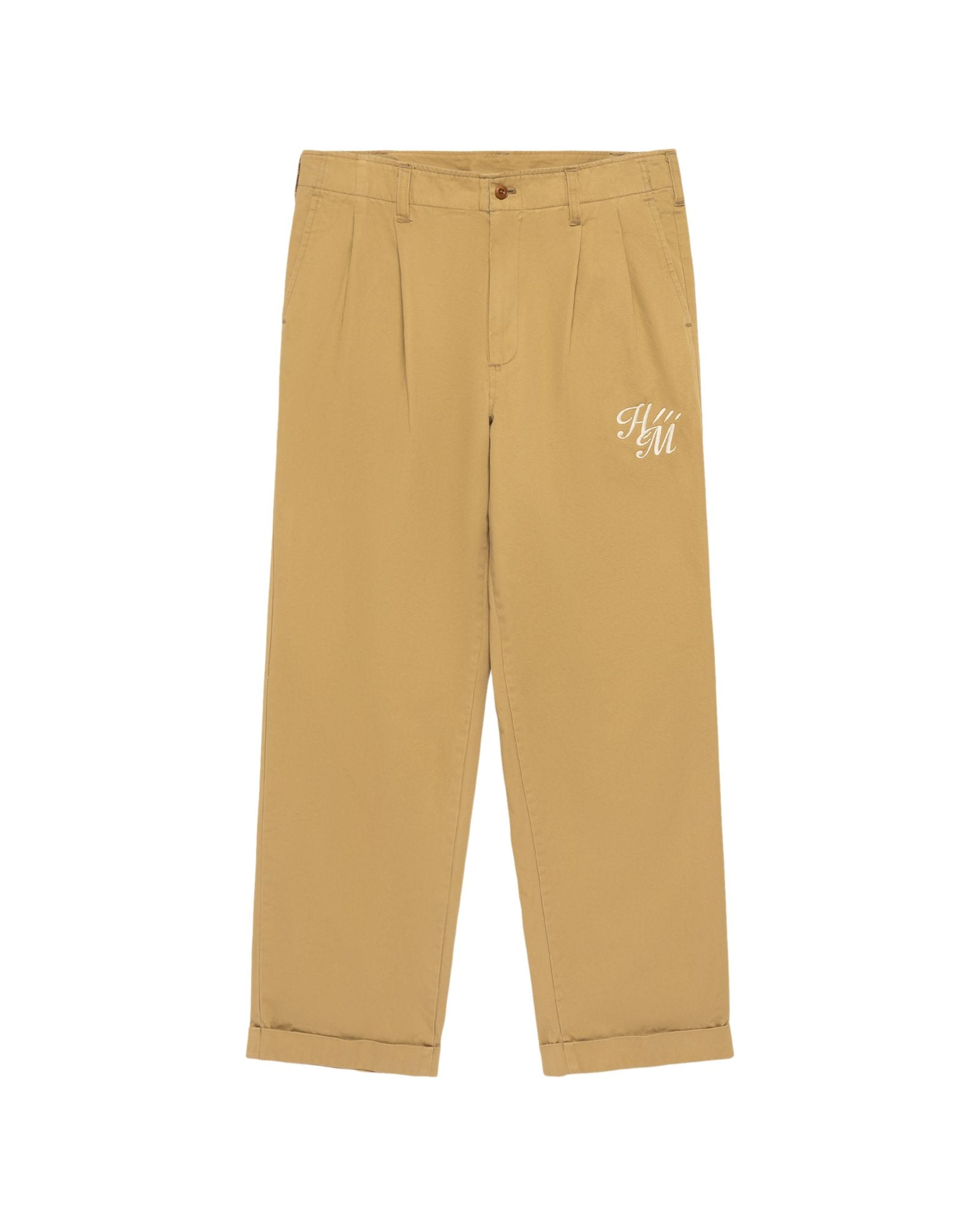 Tan chino pants with pleated front and cuffed hem, featuring small embroidered text