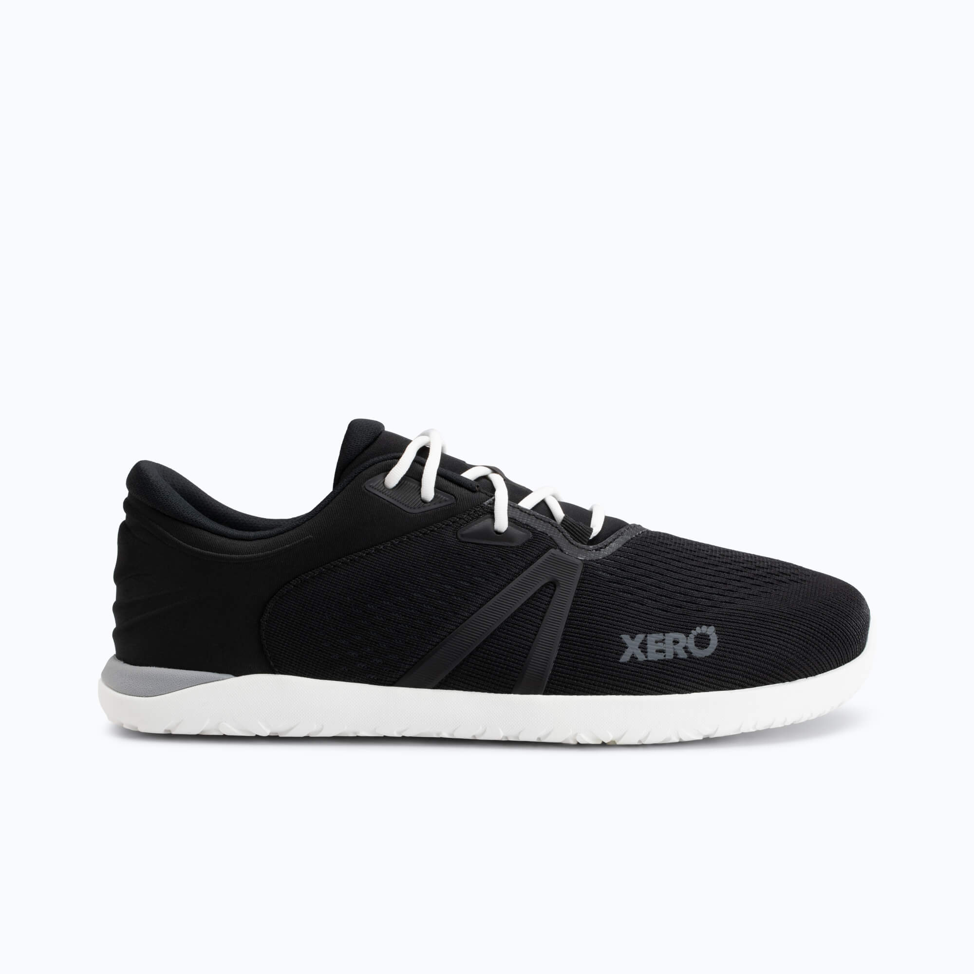 Black running shoe with white laces and white sole, shown from the side