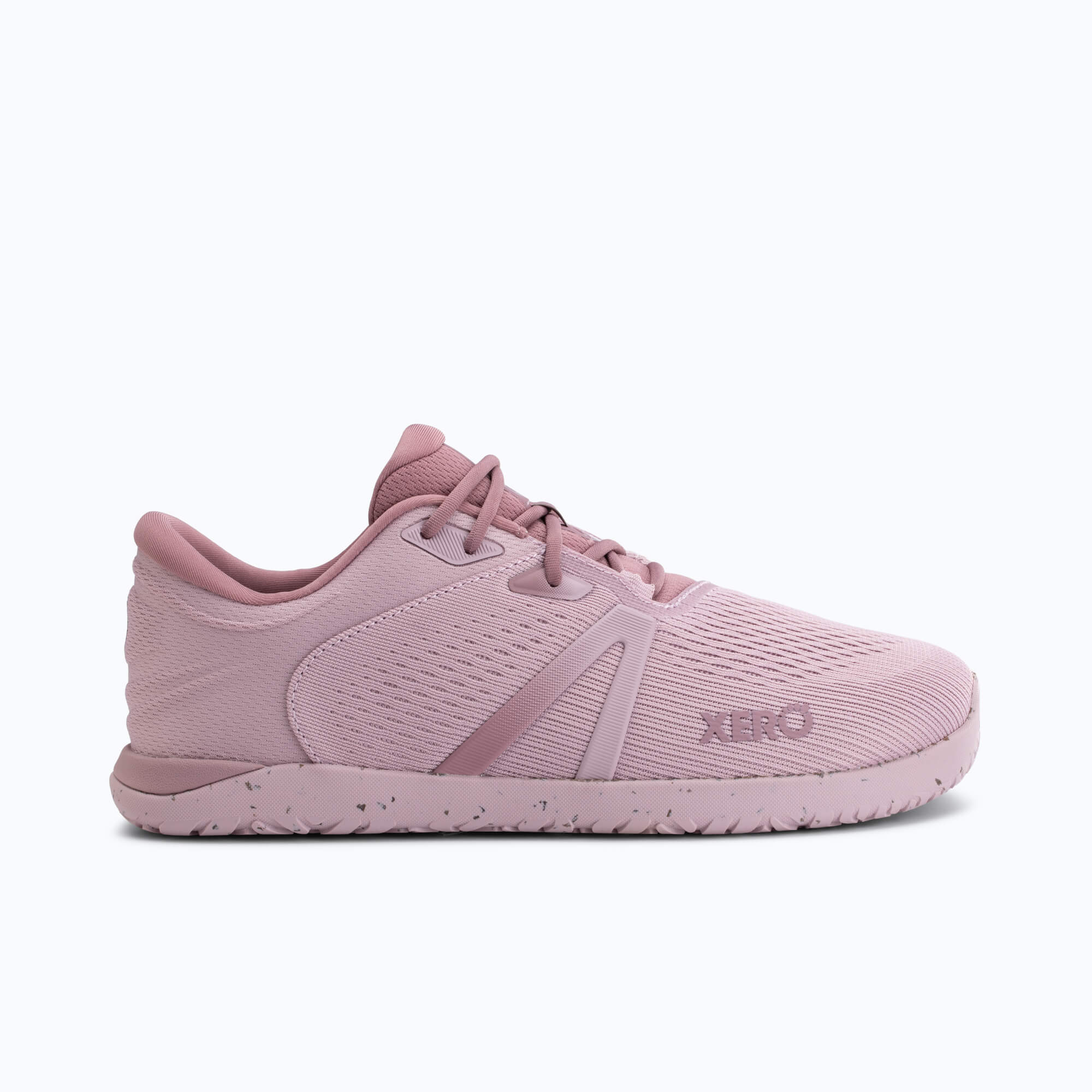 Dusty pink running shoe with pink laces and pink sole, shown from the side