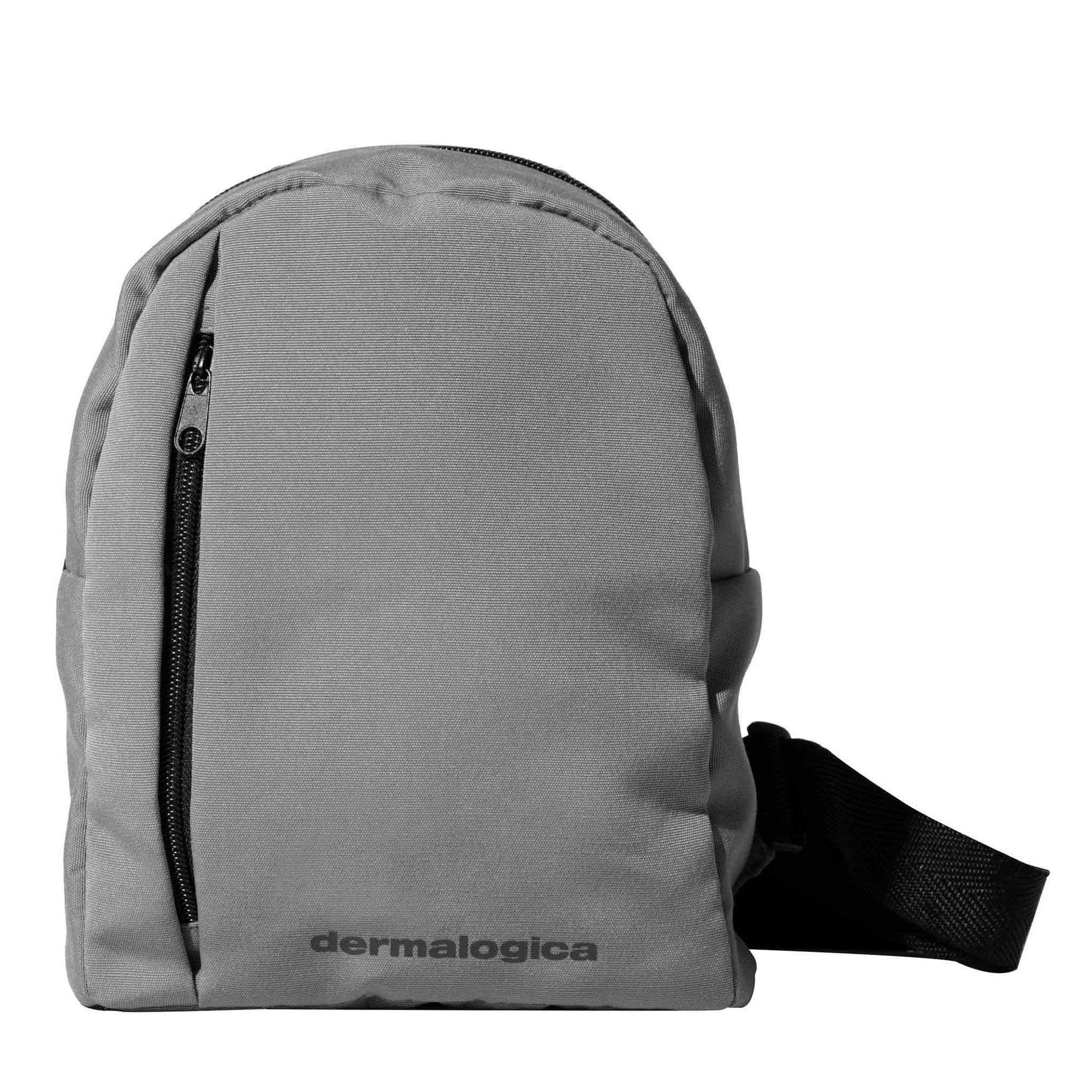 Gray canvas backpack with black shoulder strap and front zipper pocket
