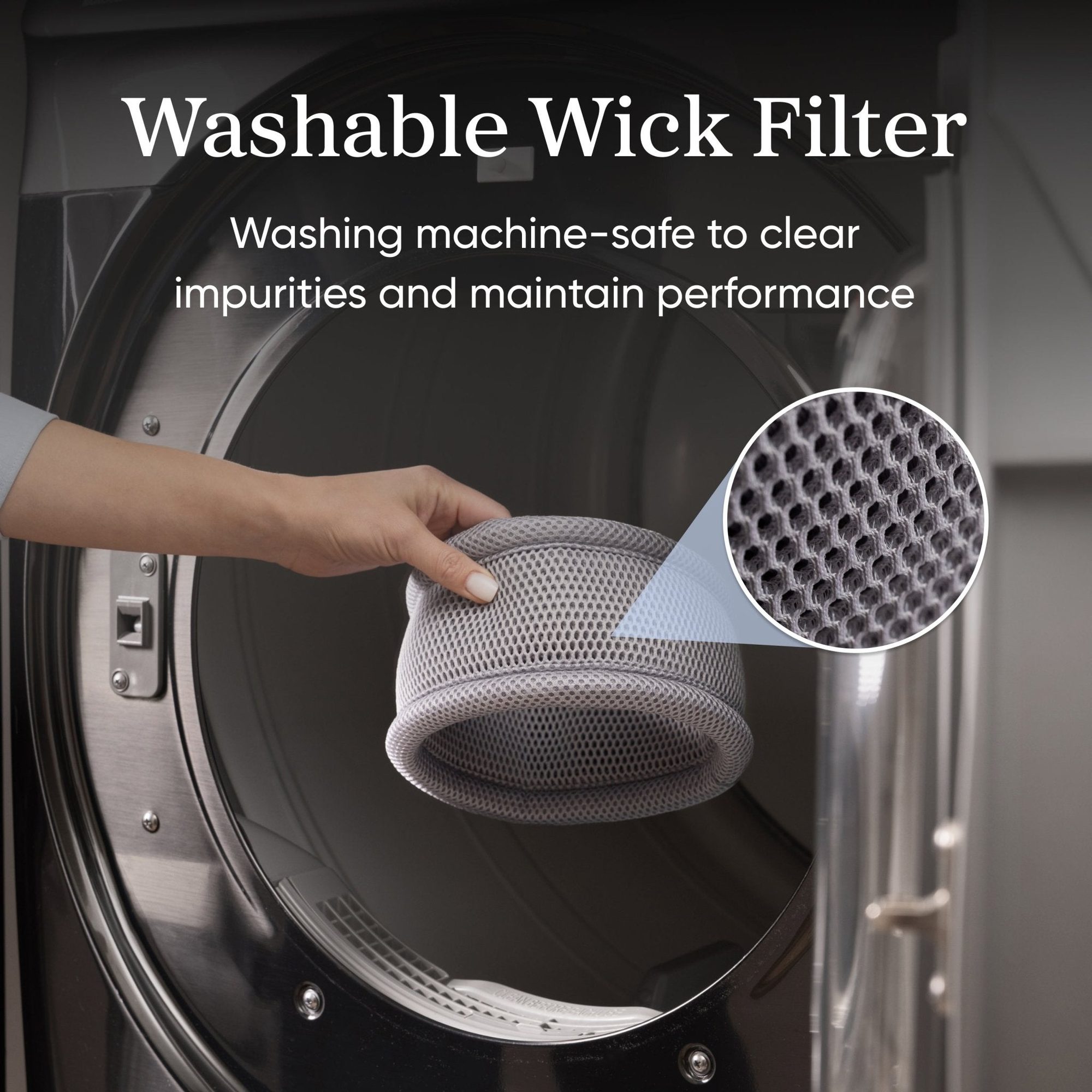 Hand holding washable mesh wick filter in front of washing machine