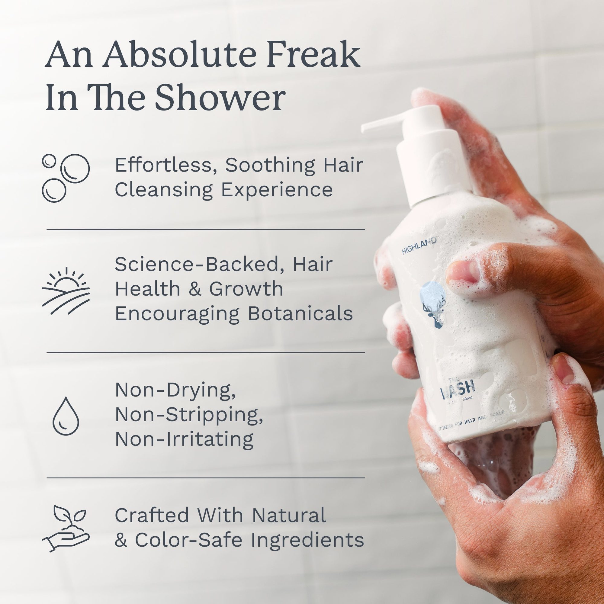 White pump bottle of hair wash held in hands with shower water and lather visible