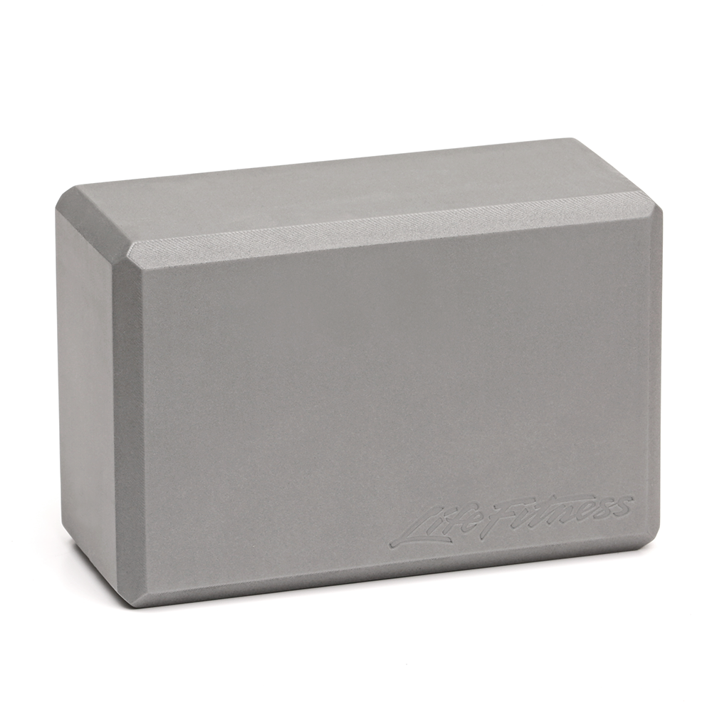Light gray foam yoga or exercise brick block