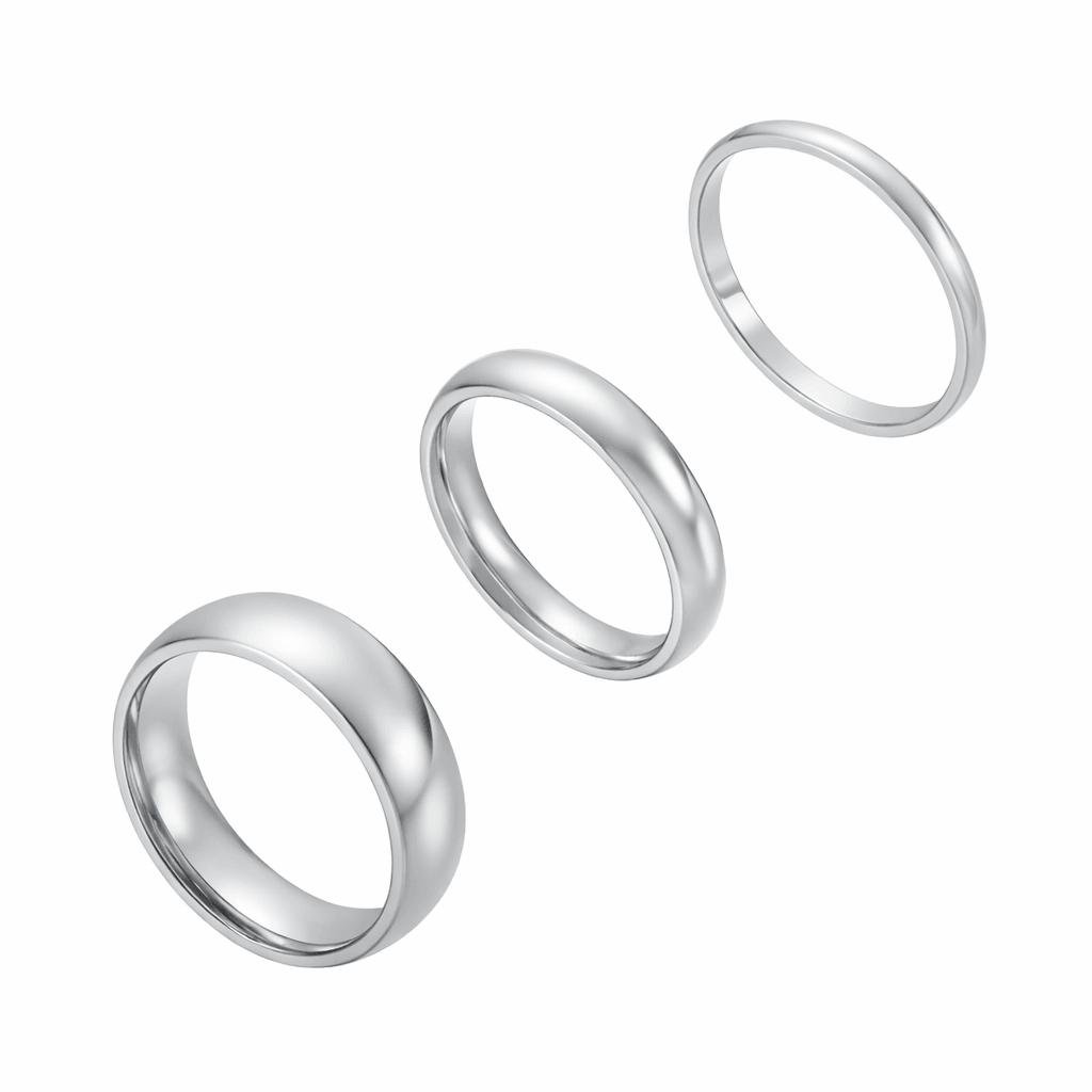 Three polished silver band rings displayed on white background