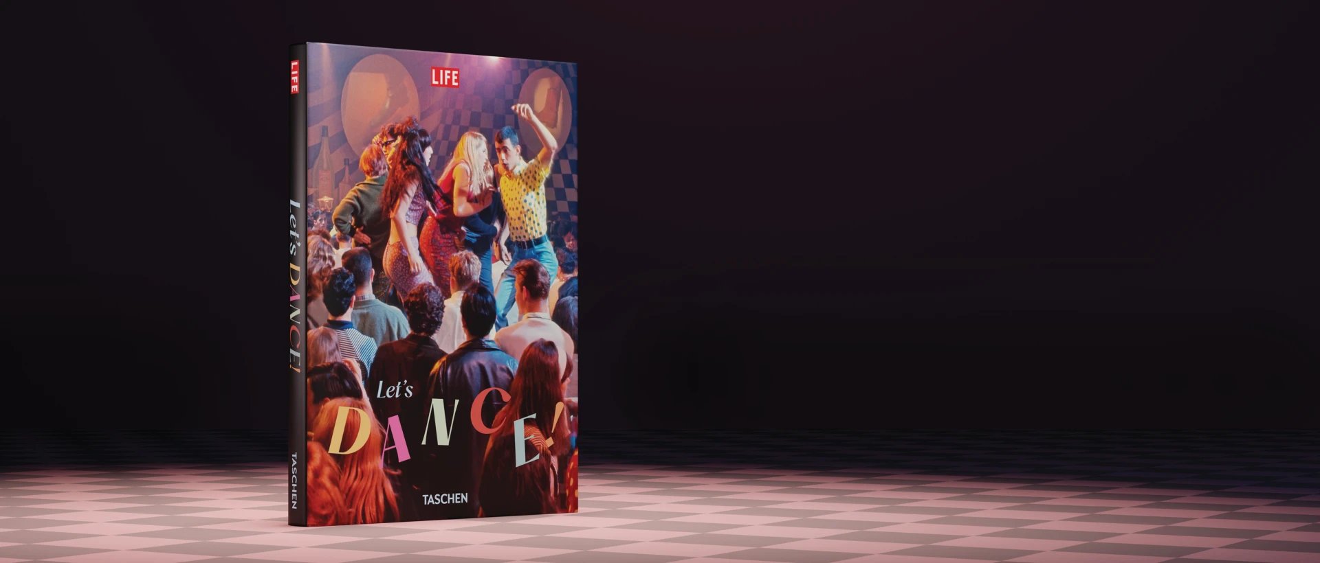 LIFE magazine 'Let's Dance' book cover displayed at an angle on a light stage floor, showing colorful vintage dancers and party scene