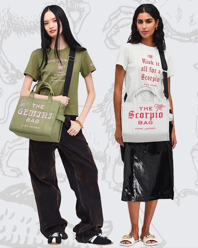 Two women modeling graphic t-shirts paired with black velvet skirts and colored tote bags