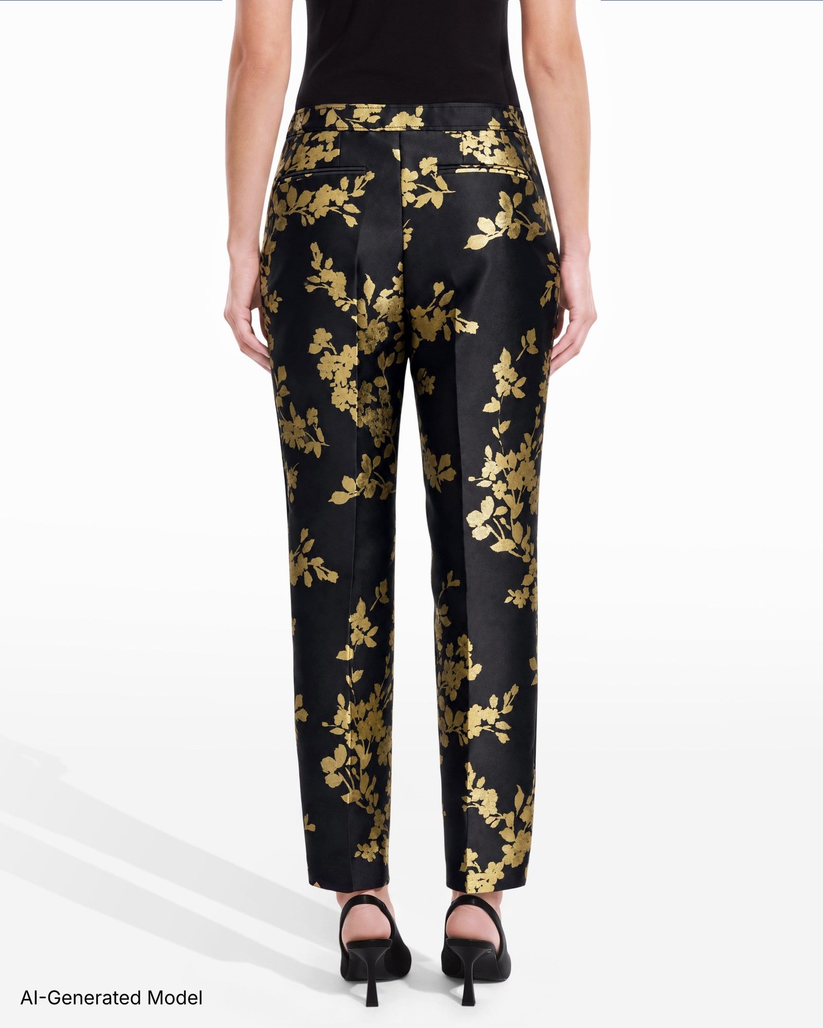 Black pants with gold floral pattern, back view on model wearing black heels